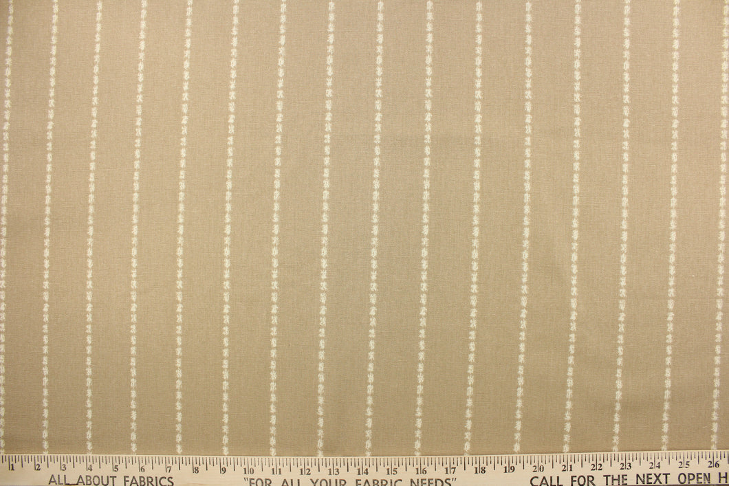 This fabric features a stripe design in off white against a beautiful beige.