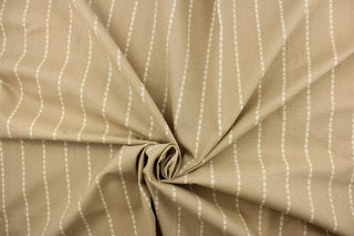 This fabric features a stripe design in off white against a beautiful beige.