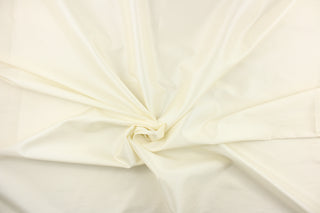 This taffeta fabric in a solid eggshell white