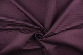 This quilted jacquard fabric in amethyst is durable and hard wearing with a rating of 30,000 double rubs.  It can be used for multi purpose upholstery, bedding, accent pillows and drapery.  