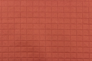 This quilted jacquard fabric in brick red is durable and hard wearing with a rating of 30,000 double rubs.  It can be used for multi purpose upholstery, bedding, accent pillows and drapery.  