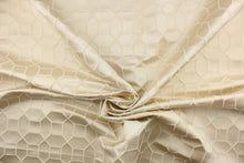 Load image into Gallery viewer, This elegant woven jacquard features a geometric design in champagne against a satin cream background.  It is clean and crisp and would work well for draperies, curtains, cornice boards, pillows, cushions, bedding, headboards and furniture upholstery.  It has a rating of 9,000 double rubs.
