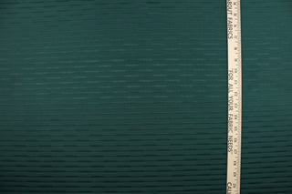 This duotone striped jacquard fabric in deep sea green is durable and hard wearing with a rating of 30,000 double rubs.  It can be used for multi purpose upholstery, bedding, accent pillows and drapery.  