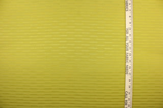 This duotone striped jacquard fabric in olive green is durable and hard wearing with a rating of 30,000 double rubs.  It can be used for multi purpose upholstery, bedding, accent pillows and drapery.  