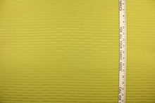 Load image into Gallery viewer, This duotone striped jacquard fabric in olive green is durable and hard wearing with a rating of 30,000 double rubs.  It can be used for multi purpose upholstery, bedding, accent pillows and drapery.  
