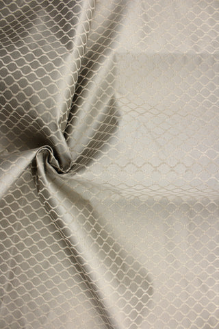 Nobhill is a woven oval design in grey against a satin weave silver background.  The various weaves create a raised effect to the ovals to add depth to the pattern.  This commercial grade upholstery fabric makes it ideal for sofas, chairs, pillows, headboards, cornice boards, window treatments and craft projects.