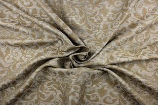This jacquard fabric features a contemporary pattern with a leaf design in light brown on a background of light blue and beige tones. The fabric has a slight sheen which enhances the design.  It can be used for multi-purpose upholstery, bedding, accent pillows, home decor and drapery.  We offer this fabric in several colors.  
