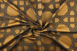 This fabric features a large geometric design in black on a copper background.  It would be great for home decor such as multi-purpose upholstery, window treatments, pillows, duvet covers, tote bags and more.  It has a soft workable feel yet is stable and durable.