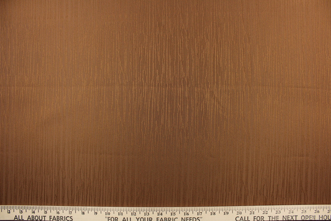 Session is a textured duo tone fabric in copper.  It is clean and crisp and would work well for draperies, curtains, cornice boards, pillows, cushions, bedding, headboards and other craft projects.
