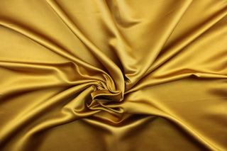 This multi-purpose mock linen in brass has a soft luxurious feel with a subtle sheen.  It would be great for home decor, window treatments, pillows, duvet covers, tote bags and more.  We offer Shauna in other colors.