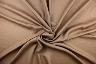 This multi purpose mock linen in hazelnut would be great for home decor, window treatments, pillows, duvet covers, tote bags and more.  We offer this fabric in other colors.