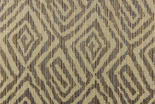 Load image into Gallery viewer, This fabric features a geometric print in the colors of gold, brown with hints of blue.   It has a soft drapable hand and would be ideal for swags, window scarves and drapery panels.
