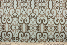 Load image into Gallery viewer, This indoor/outdoor fabric features a scroll design in taupe, and brown against a gray blue. 
