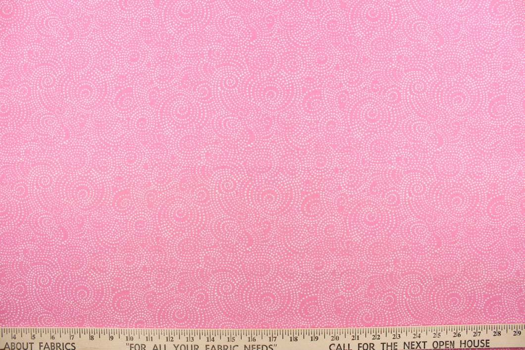 This whimsical print offers bold color with  simplicity, with a simple design of swirls of tiny white dots on a watermelon pink background. 