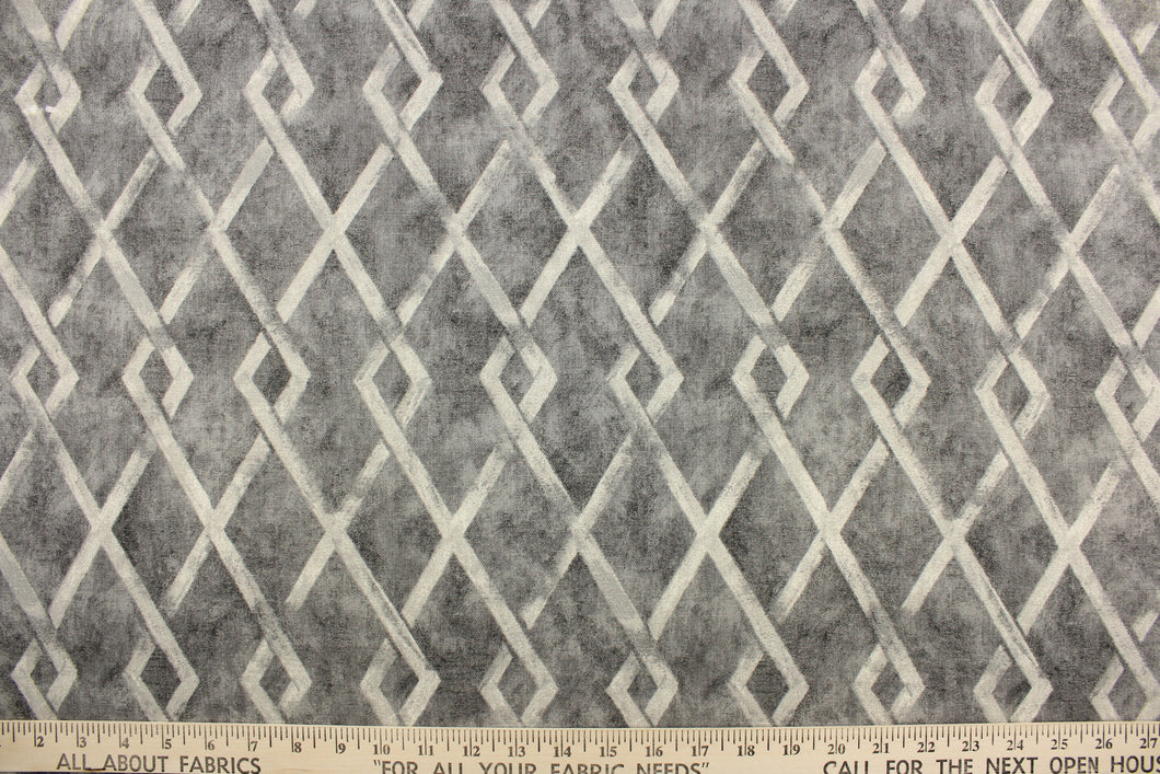 This fabric features a geometric design in gray tones. 