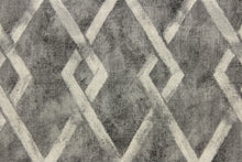 Load image into Gallery viewer, This fabric features a geometric design in gray tones. 
