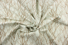 Load image into Gallery viewer, This fabric features a branch design in brown against a blue.
