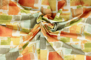 This fabric features a geometric abstract design in orange, green, golden yellow, pale turquoise, brown gray and dull white. 