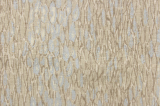 This fabric features an abstract design in brown gray tones and silvery blue colors.