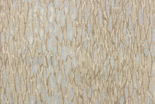 Load image into Gallery viewer, This fabric features an abstract design in brown gray tones and silvery blue colors.
