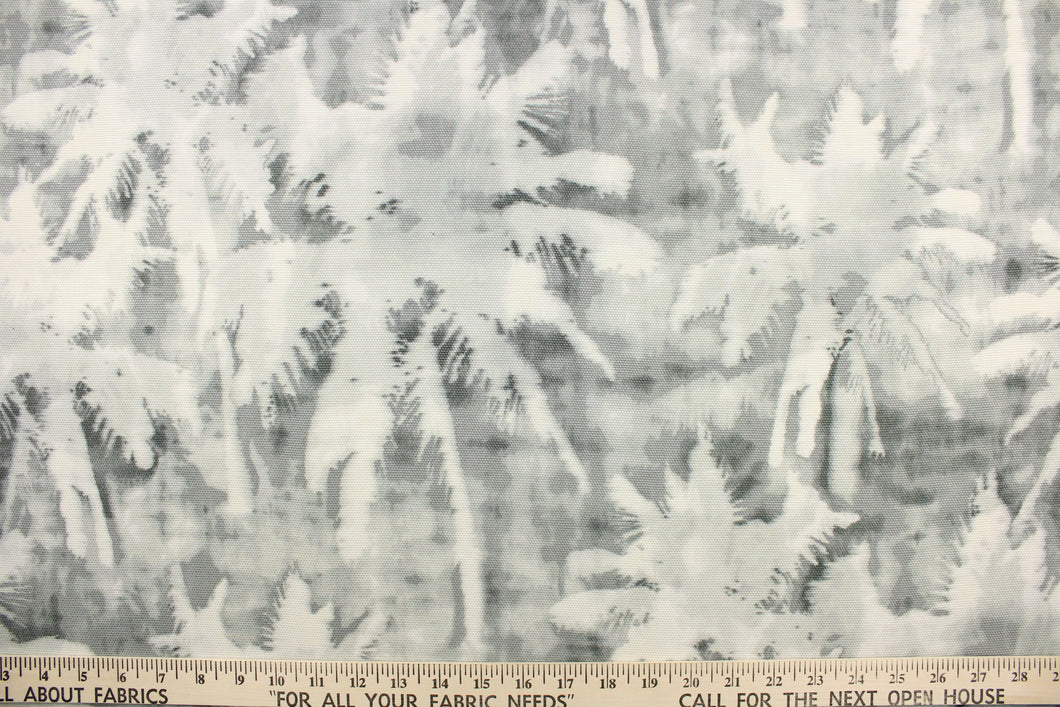 This fabric features a silhouette palm tree design in a dull white and shades of gray.