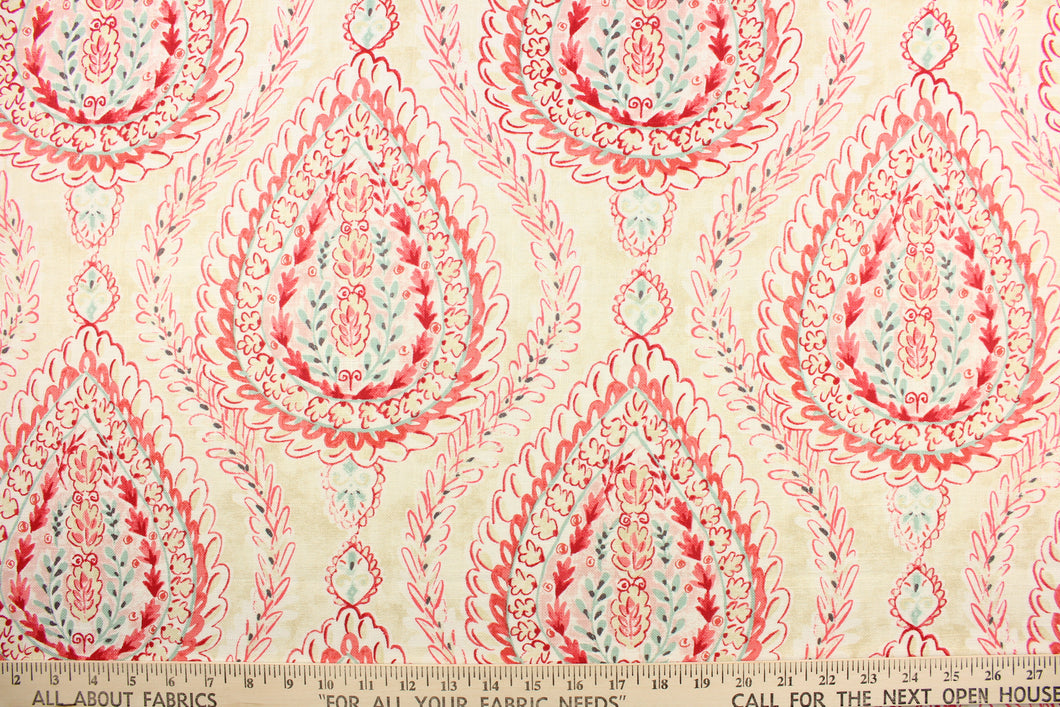 This fabric features a demask design in varying shades of pink, red, turquoise, and dark gray against a off white.