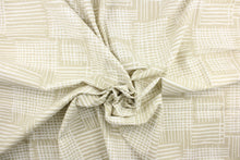 Load image into Gallery viewer, This fabric features a geometric design in a light beige and white.
