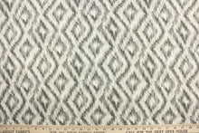 Load image into Gallery viewer, This fabric features a geometric design of diamonds in varying shades of gray against a white background.
