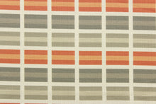 Load image into Gallery viewer, This fabric features a plaid design in orange, gray, taupe, and off white . 
