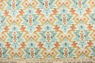 This fabric features an Aztec design in deep orange, golden beige, turquoise, white, gray, and pale peach. 