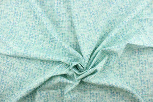  This fabric has a unique design in aqua, blue, turquoise,  seafoam, white .