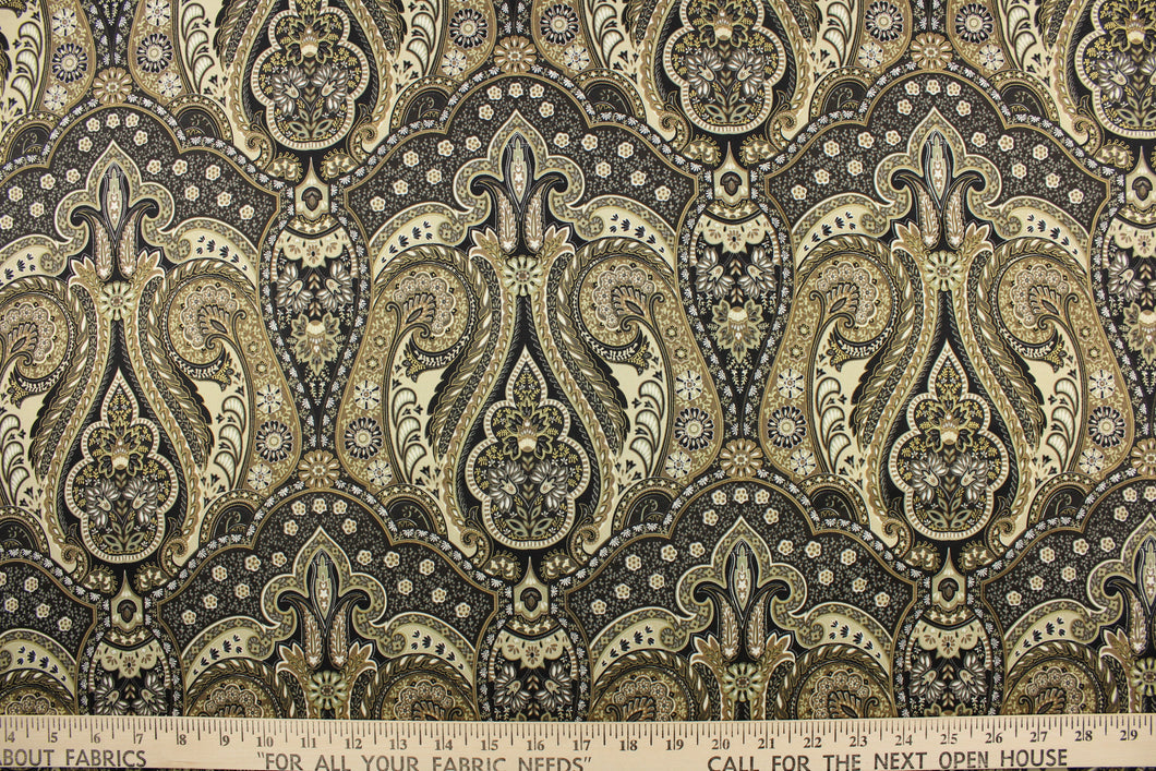 This fabric features a damask design in black, gold, taupe, beige, tan, and dark brown .