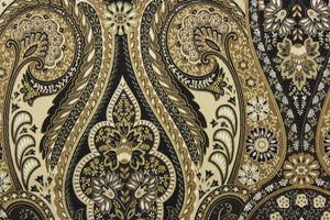 This fabric features a damask design in black, gold, taupe, beige, tan, and dark brown .