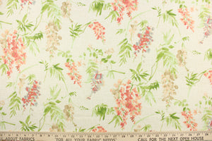 This fabric features a floral design in pink, blue , beige, green, and peach against a off white  background. 