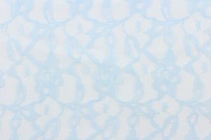 This lace features a woven floral design in a light blue  