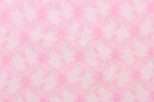 Load image into Gallery viewer, This lace features a woven floral design in a pink .
