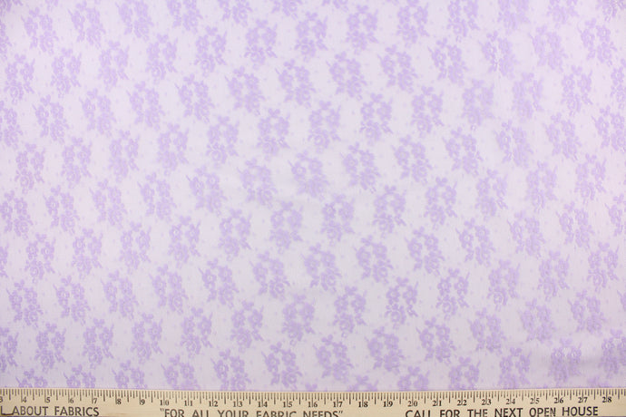  This lace features a small woven floral design in a purple .