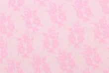 Load image into Gallery viewer, This lace features a small woven floral design in pink.
