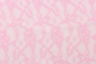 This lace features a woven floral design in pink. 