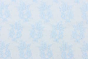 This lace features a small woven floral design in baby blue 