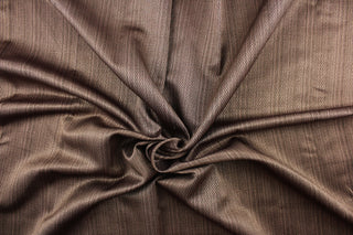 This beautiful color fabric features a herringbone design brown. 