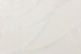 This sheer fabric features a wavy line design in white.