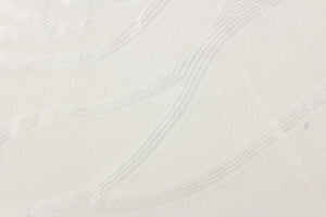 This sheer fabric features a wavy line design in white.