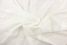 Load image into Gallery viewer, This sheer fabric features a wavy line design in white.
