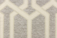 Load image into Gallery viewer, This jacquard fabric features a geometric design in gray, and white . 
