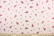 Load image into Gallery viewer, This tulle features a glittery star design dark pink against a pink background in . 
