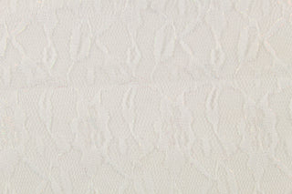 This lace features a woven floral design in a iridescent and white . 