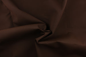 A dark brown fabric great for marine upholstery, umbrellas, outdoor upholstery and more. It has a water repellent finish, UV protection, it is fade resistant, mold and mildew resistant and abrasion resistant.