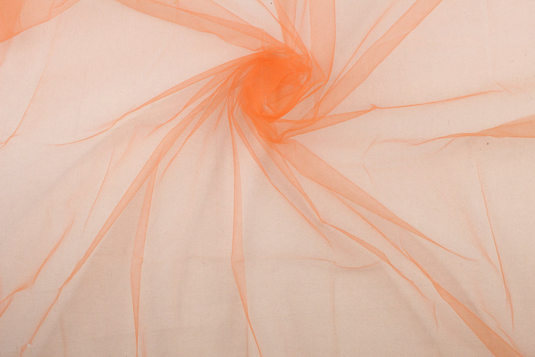 A sheer, semi firm, tulle in bright orange .