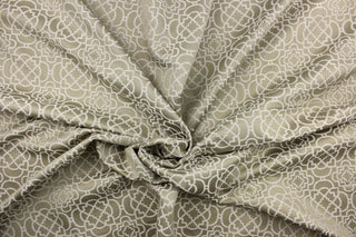  This contemporary geometric jacquard in beige with gray undertones is great for home decor such as multi purpose upholstery, window treatments, pillows, duvet covers, tote bags and more.  It has a soft workable feel yet is stable and durable with a rating of 15,000 double rubs.  We offer this fabric in several different colors.